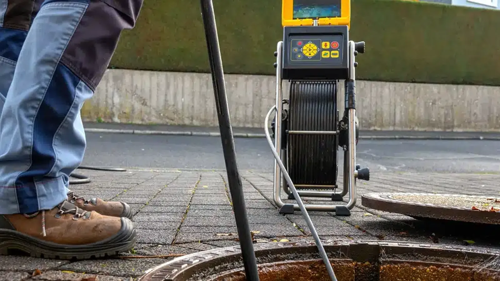 PFD Solutions engineer unblocking a drain in Bristol